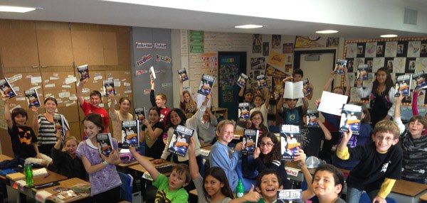 28054_194845100652590_1386236408_n Students Holding their copies of Mason Dexter: The Original Adventure